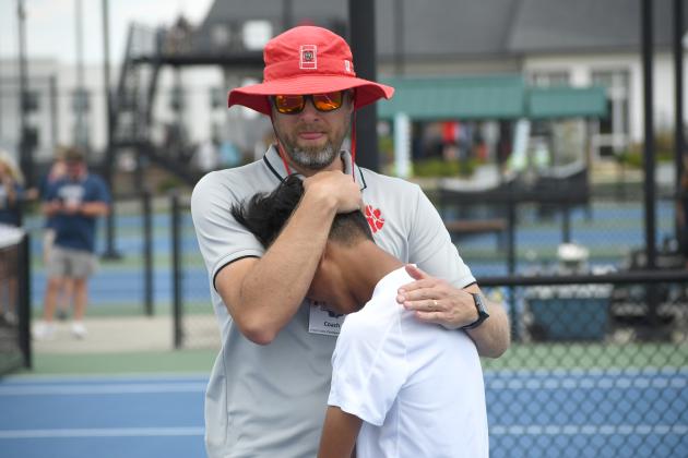 Wesley Branch/The Clayton Tribune. Rabun County head tennis coach Bryan Getty consoles his son and RCHS tennis freshman Jack Getty after the Wildcats’ loss to Brantley County in the state championship game on May 13 at the Rome Tennis Center. Getty played No. 2 singles for the Wildcats this season .