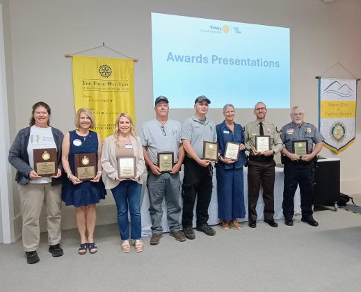 Megan Horn/The Clayton Tribune. Pictured are Laura Lane, awarded the J.C. Dover Award; Amy Hulett, awarded the Gold “R” Award; Ashley York, awarded The Wheel Award; Captain Josh Bleckley, 2026 Fireman of the Year; Tate Nichols, 2026 EMT/Paramedic of the Year; Caroline Wallis, awarded The Wheel Award; Rabun County Sheriff’s Office Deputy Mike Rodriguez, 2026 Police Officer of the Year; and Sky Valley Police Department Lt. David Edwards, 2026 Police Officer of the Year. 