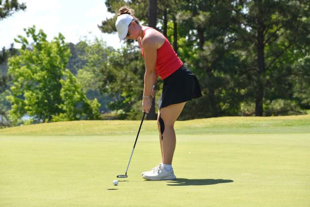 Wesley Branch/The Clayton Tribune. Rabun County sophomore Bella Hulsey follows through on a putt at the Class A Division I state championship on May 18 at Arrowhead Pointe Golf Course in Elberton. Hulsey shot a team-best 190 at the 36-hole tournament. 