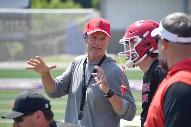 Wesley Branch/The Clayton Tribune. Rabun County head football coach Rance Gillepsie (left) talks with Colter Cannon (middle right) during the Wildcats’ 7-on–7 versus Lumpkin County and Union County on June 11 at Union County High School. Gillespie is entering his second season as the head coach of RCHS. 