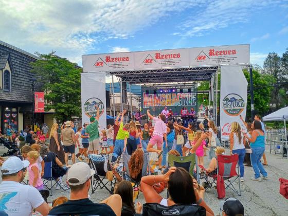 Megan Horn/The Clayton Tribune. Concert-goers to Ramshackle in downtown Clayton on Saturday, June 6 perform the Electric Slide dance while headliner Grady & The Vegabonds perform live music on the Main Stage. 
