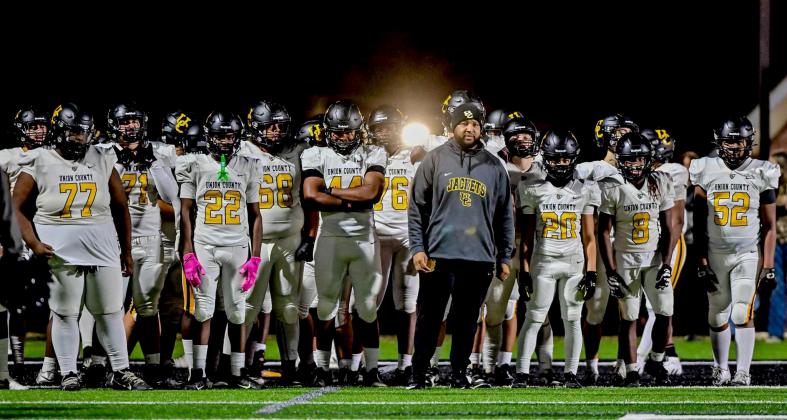 Submitted photo. Quinnon Isom (middle) prepares to lead his team onto the field before kickoff during his head coaching stint at Union County High School in Union, S.C. Isom’s hiring at Rabun Gap brings him closer to home as he is from Toccoa, Ga., and played high school football at Stephens County.  