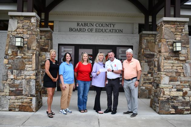 Megan Horn/The Clayton Tribune. Pictured are Rotary Club of Clayton President-Elect Laura Seberg, left; Katie Grady,  executive director of Camp Evergreen; Kelly McKay, assistant superintendent for Rabun County Schools; Karen Bacon, Rotary Club of Clayton Foundation chair; Steven Cole, superintendent of Rabun County Schools; and Matt Freeman, Rotary Club of Clayton President. 
