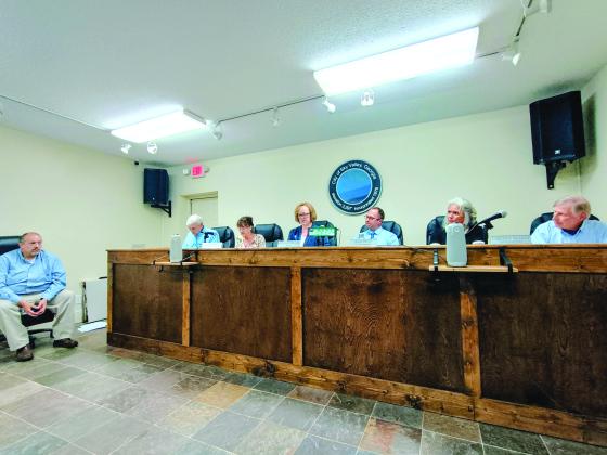 Megan Horn/The Clayton Tribune. Sky Valley city council members vote Tuesday, June 16, to accept the resignation of City Manager Jason Streetman (far left). Mayor Benita Cotton-Orr reads aloud a city news release while council members Tony Allred, Beth Pence, Jesse Price and Jim Curtis approve the resignation. Council Member CareySue Beasley recused herself from the vote. 