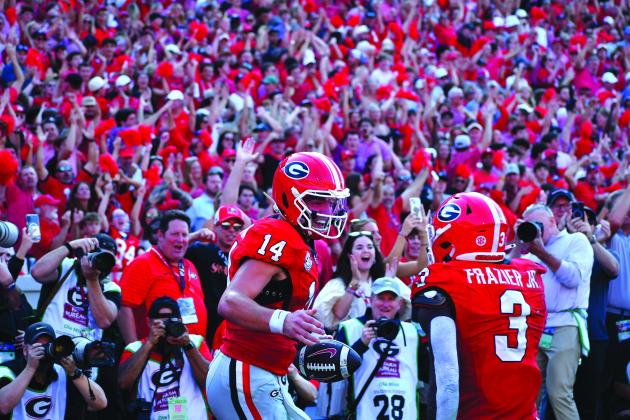 Wesley Branch/The Clayton Tribune. Former Rabun County and current UGA quarterback Gunner Stockton celebrates with teammate Nate Frazier after scoring a rushing touchdown during Georgia’s 43-35 win over Ole Miss at Sanford Stadium on Oct. 18, 2025. Stockton said at SEC Media Days on July 21 that his goal for his final season of college football is to “make memories.” Stockton and the Bulldogs will open the new season on Sept. 5 at home versus Tennessee State. 