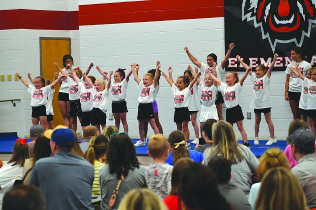 Wesley Branch/The Clayton Tribune. Rabun County campers perform their routine in front of a large crowd inside the Rabun County Elementary School lunchroom on June 25 at the RCHS lil’ Wildcats cheer camp. The Wildcat campers aged 3-13 participated in cheer classes, dance classes, arts & crafts and more during camp. 