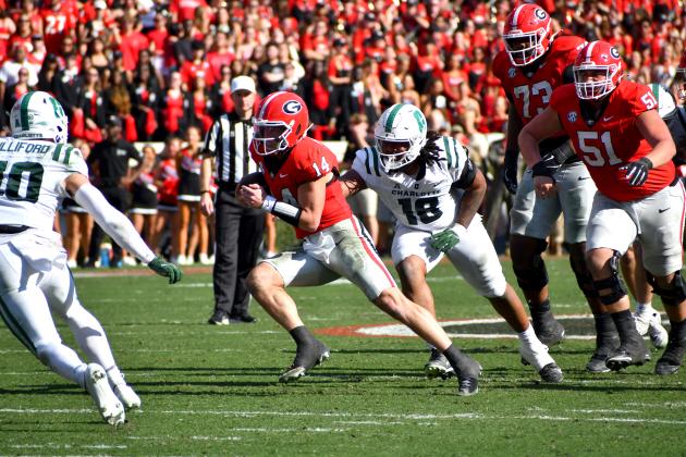 Wesley Branch/ The Clayton Tribune. Current UGA and former Rabun County quarterback Gunner Stockton evades defenders during Georgia’s 35-3 win over Charlotte on Nov. 22, 2025. Stockton is entering year two as Georgia’s starting quarterback.