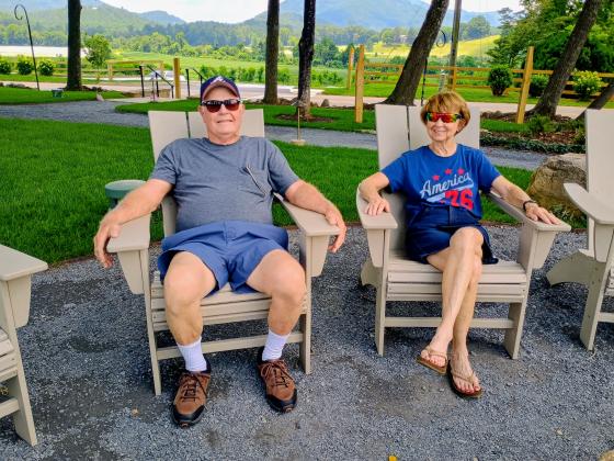 Megan Horn/The Clayton Tribune. David and Linda Braddock from South Carolina have been patrons of the Dillard House since 1971. They enjoy a relaxing time by the fire pit in the OakLawn on Saturday, July 4. 