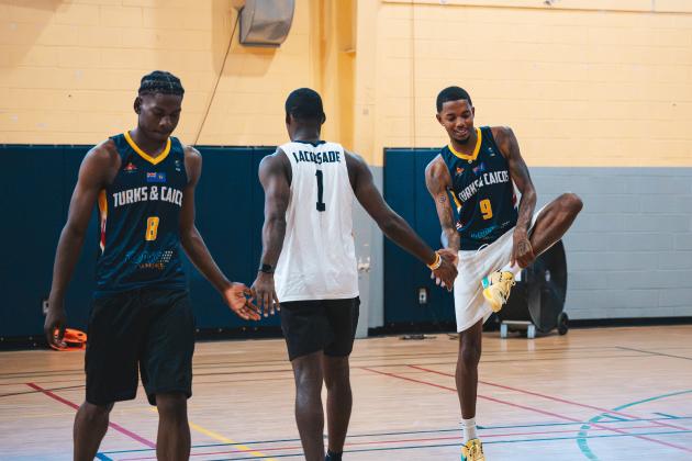 Submitted photo. Recent Rabun Gap graduate RJ Lacossade (center) high fives teammates during a practice with the Turks & Caicos national team in preparation for the 2029 FIBA AmeriCup Caribbean Pre-Qualifiers. Lacossade, who is signed with Southern Wesleyan University, was born in Turks & Caicos and left his home country at the age 14 to chase his basketball dreams. 