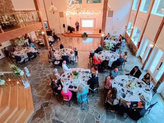 Megan Horn/The Clayton Tribune. Aaron Hooker plays a worship set during the Choices Pregnancy Center Heartbeat Gala on Aug. 1 at Chota Falls. Gala guests sang along and praised God with hands in the air. The venue was beautifully lit and decorated. 