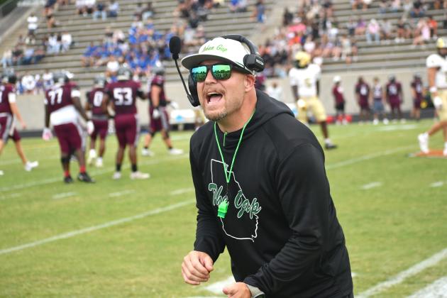 Wesley Branch/The Clayton Tribune. Rabun Gap head football coach Derek White directs his team on the sideline during Rabun Gap’s Aug. 14 scrimmage versus Westside (S.C.). RGNS will face Venice (Fla.) on Aug. 21 at home to open the season. 