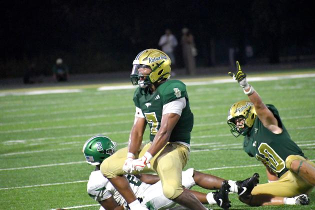 Wesley Branch/The Clayton Tribune. Rabun Gap linebacker Praise Chane (center) celebrates after making a tackle for a loss on third down during Rabun Gap’s 42-40 overtime loss on Aug. 21. Chane, a senior, is committed to the Naval Academy. 