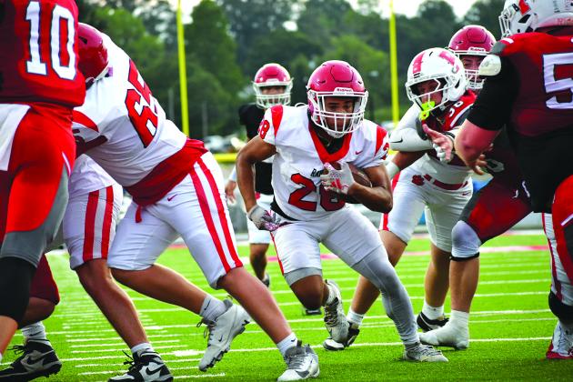 Enoch Autry/The Clayton Tribune. Rabun County sophomore running back Amir Thompson goes up the middle in the second half of the scrimmage against Franklin for a touchdown. The score was set up by multiple runs by senior running back JK Fruster. The Wildcats open their regular season on Aug. 28 at home against Metter.