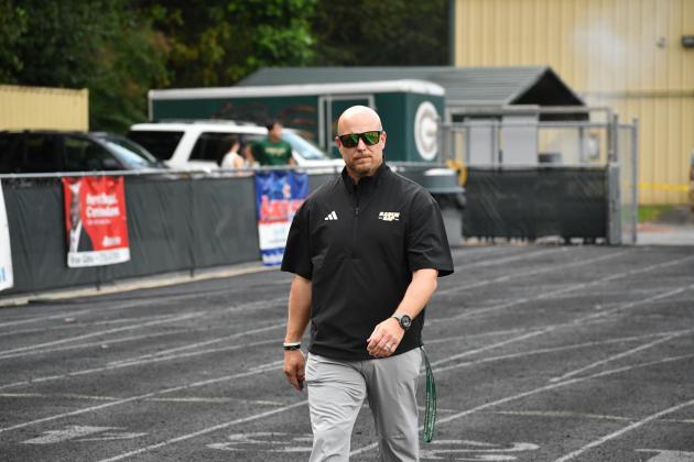 Wesley Branch/The Clayton Tribune. Rabun Gap head football coach Derek White walks to the field ahead of his team's game versus Grayson in 2025.