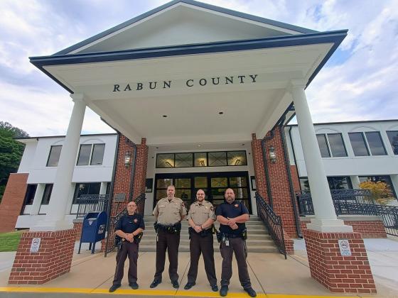 Megan Horn/The Clayton Tribune. The sheriff is mandated by law to provide the security of the Rabun County courthouse and the safety of superior court judges, magistrates, support staff and citizens who visit the county courthouse. The agency’s Judicial Process and Criminal Process Sections also serve in this division. Bailiffs pictured are Sgt. Tony Parrish, who oversees courthouse security, Steve Osborne, Daniel Nicholson and Joseph Silva.