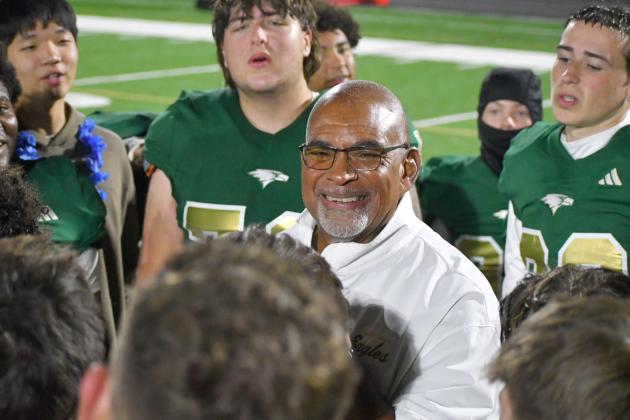 Wesley Branch/The Clayton Tribune. Rabun Gap defensive line coach Joe Crosby smiles as the RGNS football team wishes him a happy 70th birthday after their regular season win over Christ School last season. Crosby has been coaching at Rabun Gap for six years.