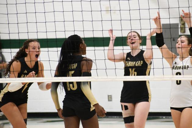 Wesley Branch/The Clayton Tribune. RGNS girls volleyball team celebrates after a point during its 3-1 win versus Swain County on Sept. 28. The RGNS girls improved to 7-11 with the win, and have gone 7-4 in their last 11 matches after an 0-7 start.