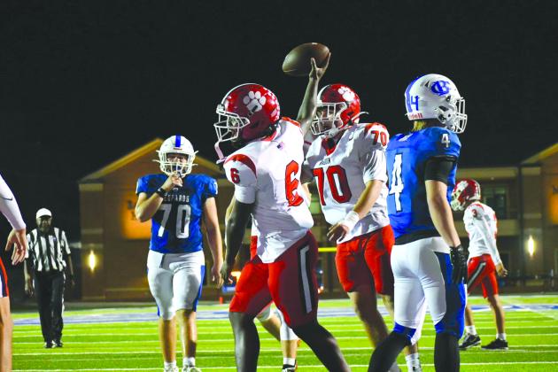 Enoch Autry/The Clayton Tribune. Senior JK Fruster celebrates one of his three rushing touchdowns with teammate Ron Baumes (70) on Sept. 25 as the Wildcats defeated Banks County 45-10. The next RCHS game is Oct. 9 at home.