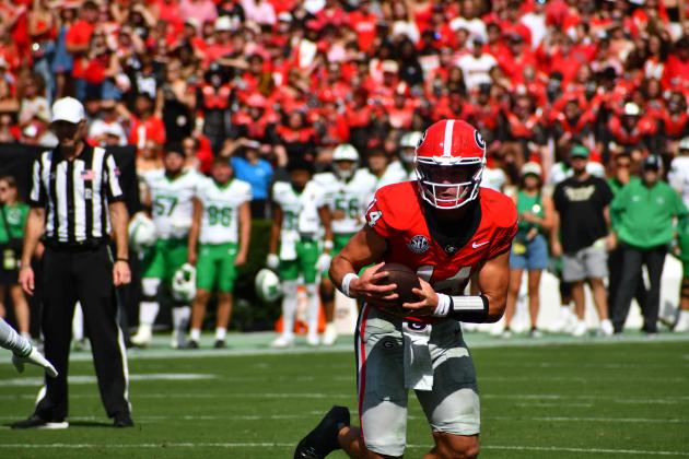 Wesley Branch/The Clayton Tribune. In his first regular-season game as a starter, Bulldog quarterback Gunner Stockton of Tiger pulls the ball down on a scramble against visiting Marshall on Aug. 30, 2025. Georgia opens its 2026 season again at home as Tennessee State comes to Athens.