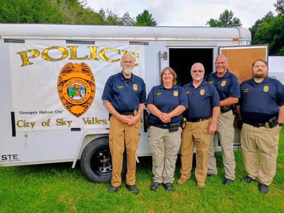 Megan Horn/The Clayton Tribune.  The Sky Valley Police Department hosted this year’s National Night Out (NNO) event on Tuesday, Aug. 4. The event built community trust and partnerships. Pictured are members of the Sky Valley Police Department including Chief Ron Baumes, left, Officer Clark, Lt. Edwards, Sgt. Maloney and Officer Golden. 
