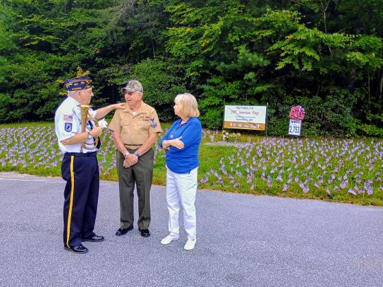Megan Horn/The Clayton Tribune. Veteran Doug Wayne, Major (Ret.) U.S. Army, left; Bruce Gant, Navy Corpsman, Vietnam Combat veteran and two-time Purple Heart recipient; and Vicky Gant reflect on the lives lost 25 years ago on Sept. 11, 2001. They attended a special event in Sky Valley last Friday to honor the lives lost that terrible day. 