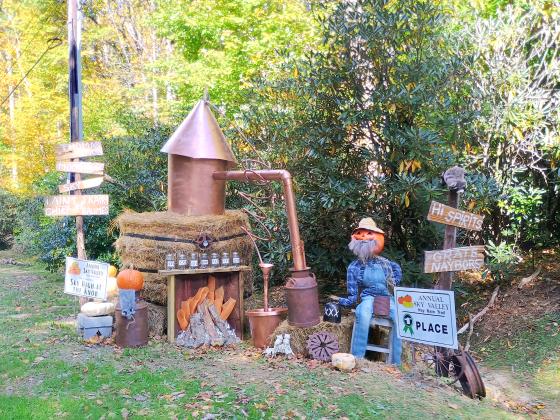 Megan Horn/The Clayton Tribune. The first place winner of the Sky Valley Hay Bale Trail was “Sky High at The Knob” for this hay bale that was decorated as a moonshine still.  The Sky Valley Fall Festival day was filled with plenty of fun.