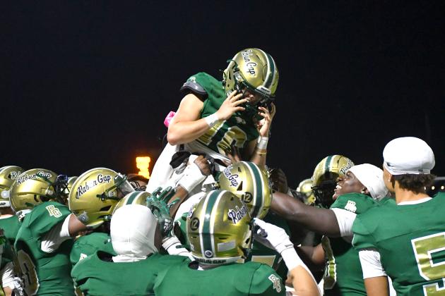 Wesley Branch/The Clayton Tribune. Rabun Gap players lift Hector Nahle (center) into the air after Nahle scores a touchdown in RGNS’ 42-0 win versus Christ School in 2025. Nahle was a backup quarterback for two years before transitioning to receiver