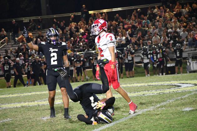 Enoch Autry/The Clayton Tribune. Rabun County’s senior receiver Reed Lafevers reacts to Commerce cornerback Makiy Sanders’ (7) interception in the final minutes of the Tigers’ 28-7 region win over the visiting Wildcats on Oct. 16. Commerce safety Jace Lyle signs the tunover to keep the Tigers undefeated.