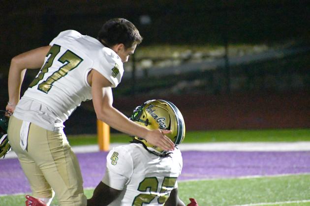 Wesley Branch/The Clayton Tribune. RGNS running back Jordan Lindo (25) and kicker Andres Salazar Duarte celebrate on the field after Rabun Gap’s 28-27 overtime win versus Christian Brothers College on Oct. 2. RGNS faces Christ School next.