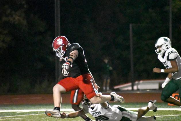 Wesley Branch/The Clayton Tribune. Rabun County senior defensive lineman Ryan Yearwood evades Athens Academy quarterback Baynes Collins for a pick-six during the second quarter of Rabun County’s 31-0 win versus Athens Academy on Oct. 9. Yearwood contributed to one of the Wildcats’ defensive touchdowns. 