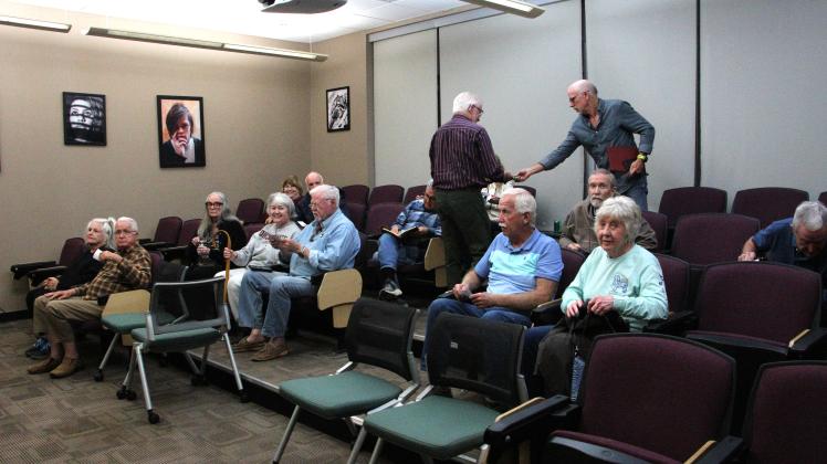 Mae Sullens/CNI News Service. Members of the Foothills Photography Group participate in a discussion on AI and photography.