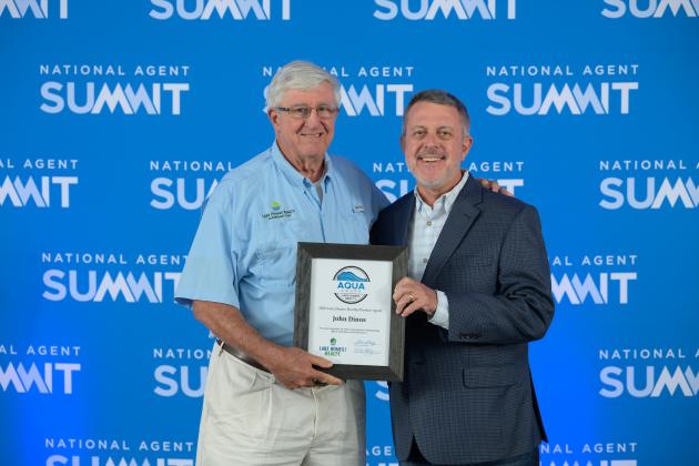 Submitted. John Dinos, left, receives high honors at National Agent Summit.