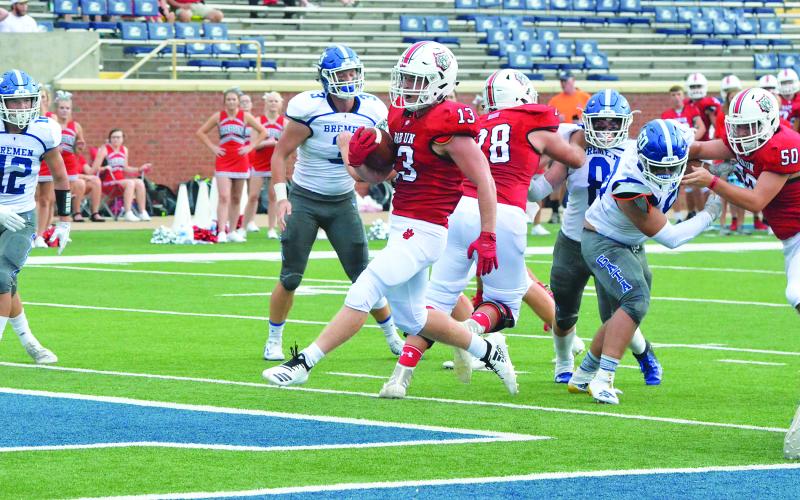 Rabun County running back Brody Jarrard (13) runs for a touchdown during the first half against Bremen in the Erk Russell Classic at Georgia Southern’s Paulson Stadium in Statesboro last Saturday night. (Wayne Knuckles/The Clayton Tribune)