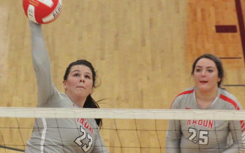 Destiny Deetz (23) attempts a kill while teammate Lyndee Hollifield (25) looks on during a match against Prince Avenue Christian at Ken Byrd Court in Tiger on Tuesday night. (Glendon Poe/The Clayton Tribune)