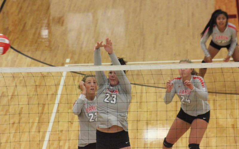Rabun County’s Destiny Deetz, right, attempts a block while teammate Lexi Crump watches against Lumpkin County on Tuesday night. (Glendon Poe/The Clayton Tribune)