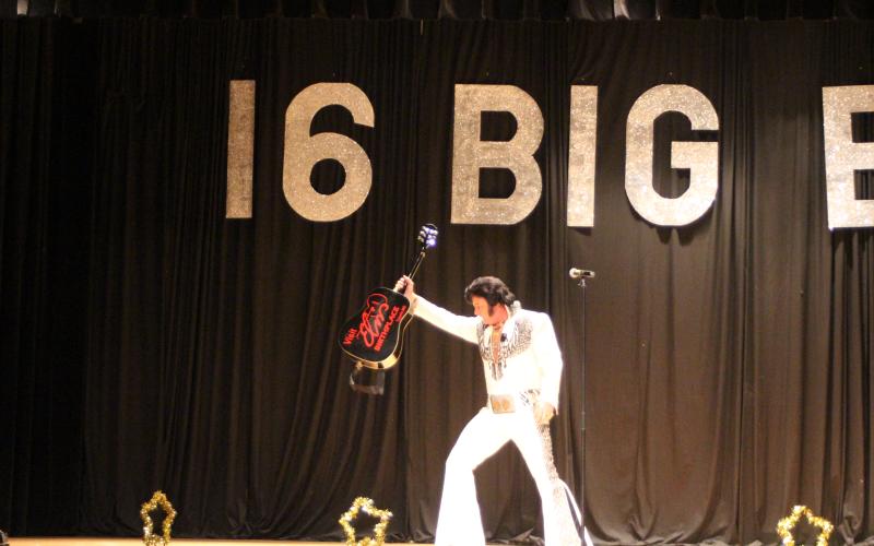 Megan Broome/The Clayton Tribune. World Champion Elvis Tribute Artist David Lee entertains a crowd of Elvis fans who attended a concert on the weekend of the 2019 Big E Festival and Elvis Tribute Artists Competition by singing, dancing and showing off his guitar.