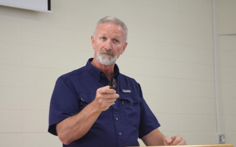 Megan Broome/The Clayton Tribune. Roger Fitzpatrick, site administrator at the Rabun County location of Mountain Education Charter High School, speaks to faculty and staff members for the Rabun County site as well as administrators from the central office and other regions at a celebration event at the Mountain Education Charter High School location in Tiger Monday.