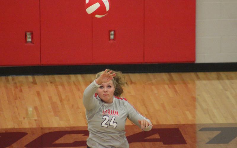 Rabun County’s Beth Payne serves against White County during a match at Rabun County’s Ken Byrd Court in Tiger on Tuesday night. (Glendon Poe/The Clayton Tribune)