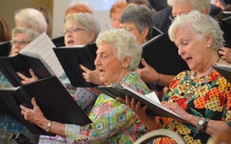 Wayne Knuckles/The Clayton Tribune. Kathleen Arbitter and Linda Brandsma join the rest of the choir in song as Clayton Baptist Church celebrated their 200th anniversary Sunday.