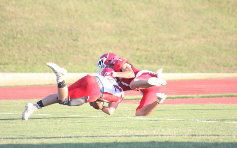 Rabun County’s Dawson Lathan (1) tackles a Franklin (N.C.) player in the end zone during the first quarter of a preseason game at Frank Snyder Memorial Stadium in Tiger last Friday night. The play resulted in a safety. (Glendon Poe/The Clayton Tribune)
