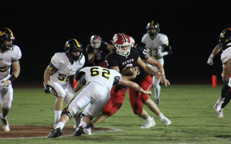 North Murray defensive lineman Hayden Jones (62) attempts to tackle Rabun County linebacker AJ Wheeler (3) after an interception during the second half at Frank Snyder Memorial Stadium in Tiger on Aug. 30. (Glendon Poe/The Clayton Tribune)