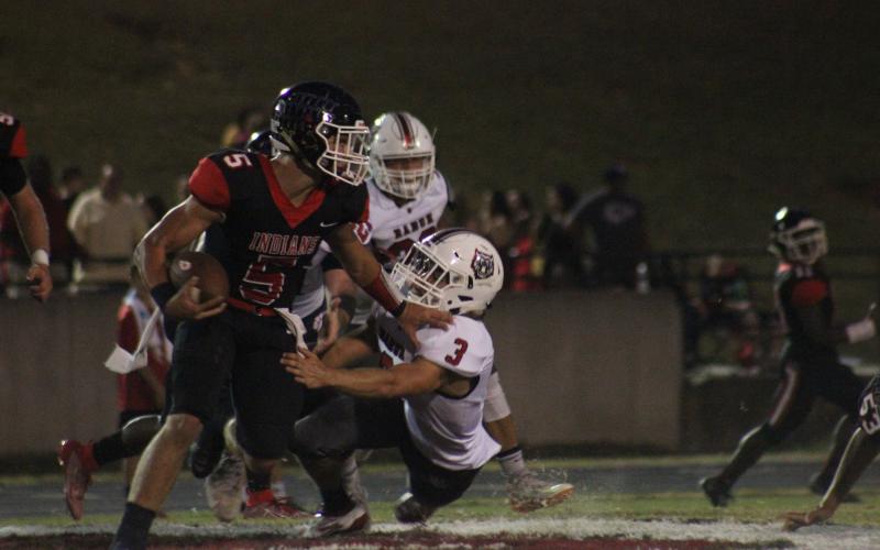 Rabun County linebacker AJ Wheeler (3) attempts to tackle Stephens County running back Hudson Spurlock (5) during the first half in Toccoa last Friday night. (Glendon Poe/The Clayton Tribune)