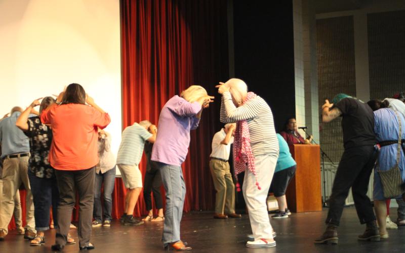 Megan Broome/The Clayton Tribune. Cherokee Friends from the Museum of the Cherokee Indian, Jarrett Wildcatt, Malaciah Taylor and Nola Teesateskie, give lessons on Cherokee dances to attendees of an event highlighting Cherokee history in Rabun County with folklorist Barbara Duncan at the Rabun County High School Fine Arts Building on Saturday evening. Here they are performing a Cherokee Buffalo Dance.