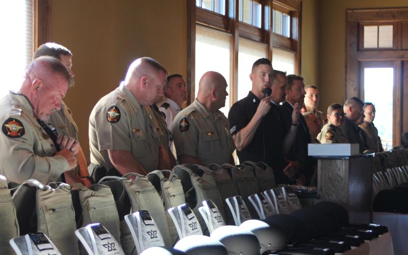 Chris Brown, vice president of SHIELD616, presents new protective gear to the Rabun County Sheriff's Office at The Waterfall Club on Aug. 29