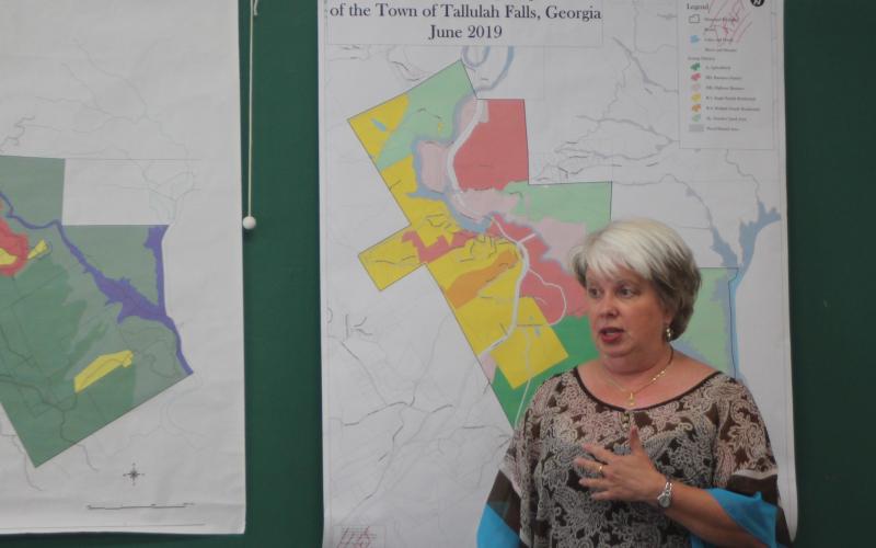 Tallulah Falls Mayor Teri Dobbs looks over a zoning map of the town at a joint work session of the City Council, Downtown Development Authority and Planning Commission last Thursday. City officials plan to add updates to the 1999 zoning map.