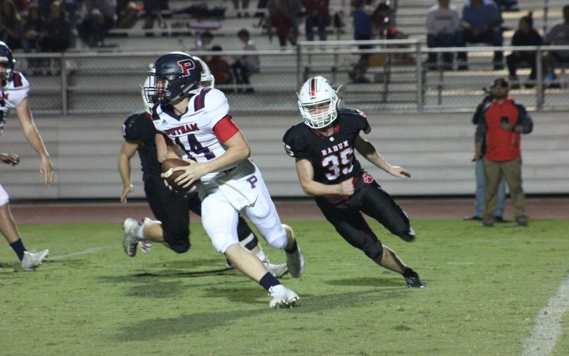 Rabun County linebacker Trent Miller (35) pursues Putnam County quarterback Waylon Wooten during the first half at Frank Snyder Memorial Stadium in Tiger last Friday night. (Glendon Poe/The Clayton Tribune)