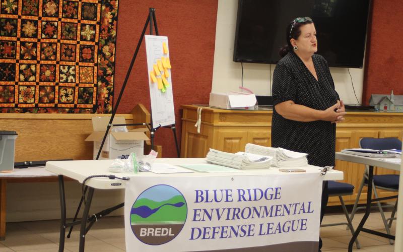 Megan Broome/The Clayton Tribune. Cherie Faircloth, founding member of the Rabun Gap Chapter of the Blue Ridge Environmental Defense League (BREDL), speaks at community discussion she organized addressing “What’s in your water?” at St. James Episcopal Church Sept. 25. The goal of the discussion was to spark community interest and action about concerns of chemicals in the drinking water supply and how they are tested for.