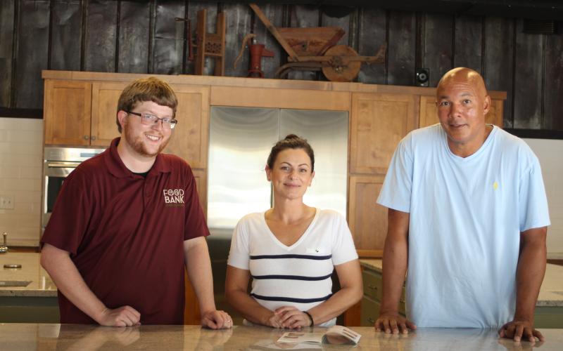 The Food Bank of Northeast Georgia organizes programs and provides resources to help people in need in Rabun County and the surrounding counties. Stephen MOntgomery-Anderson, operations manager, left, Sam Thacker, Teaching Kitchen manager, and James Brim, director of the Food Bank Mountain Branch, stand behind the counter in the Food Bank Teaching KItchen that provides cooking classes to people of all ages.
