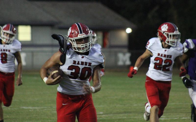Rabun County linebacker Hoff Windham (30) runs behind blockers after intercepting a Monticello pass during the first half in Monticello last Friday night. (Glendon Poe/The Clayton Tribune)