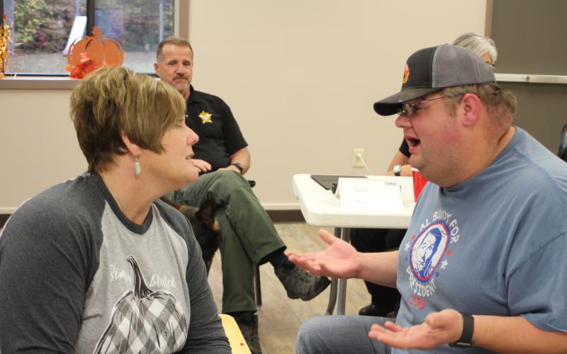 Lt. Misty Houston, Rabun County Emergency Medical Services, and Deputy Andy Beck help sort out people’s problems by walking through an example narrative of a peer in a crisis situation during a scenario-based workshop at Peer Support training held at Tabernacle Baptist Church last Monday.